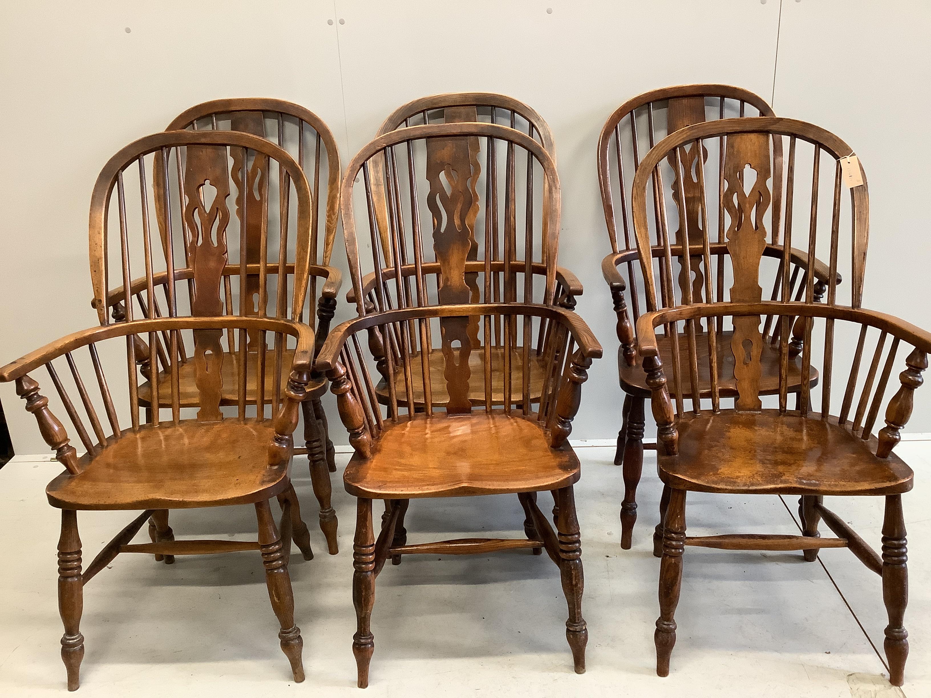 A set of six 19th century ash and elm Windsor armchairs with H stretchers and later leatherette squab seats, width 58cm, depth 38cm, height 116cm